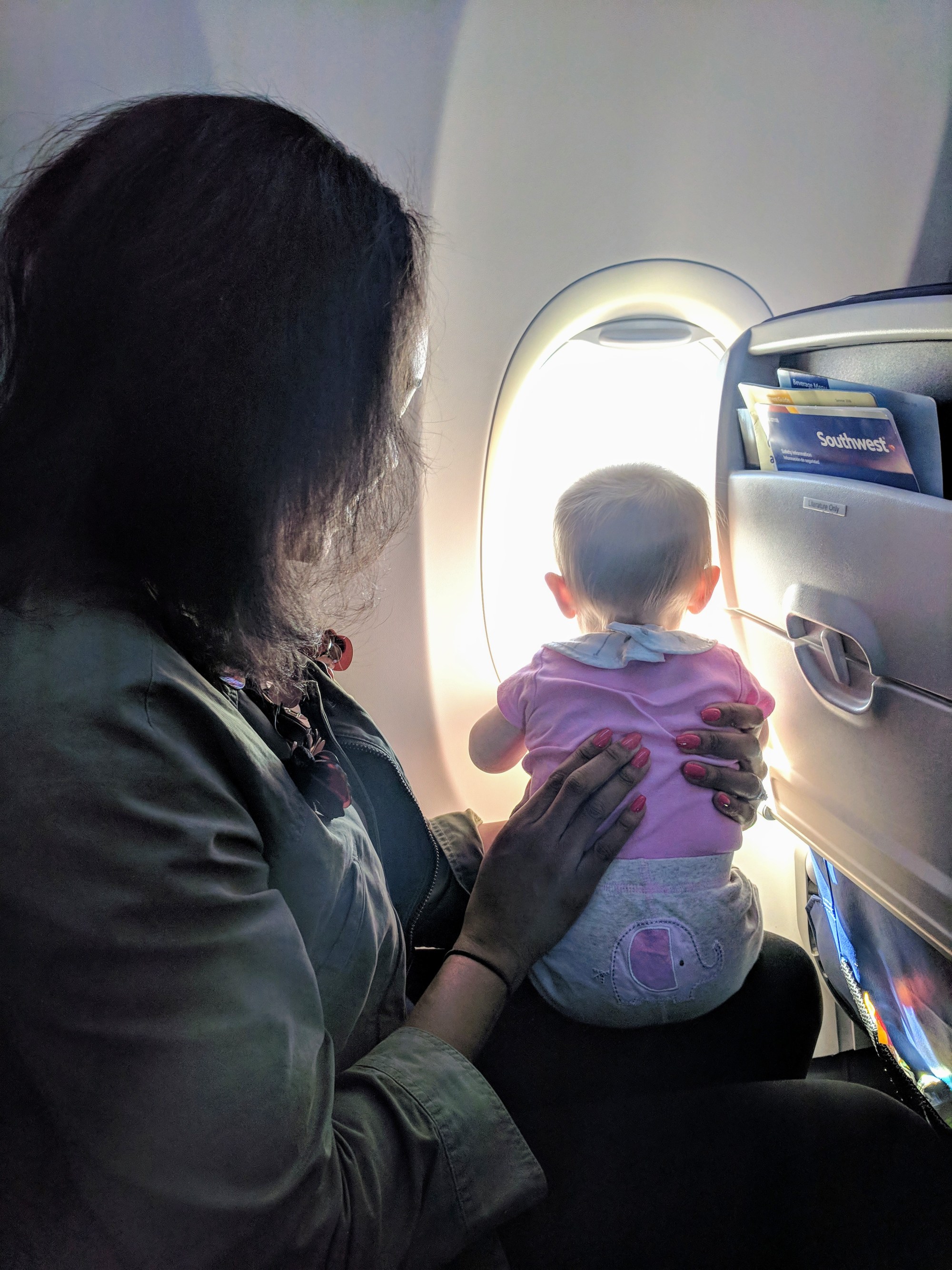 Candace entertaining Violet while Mommy eats