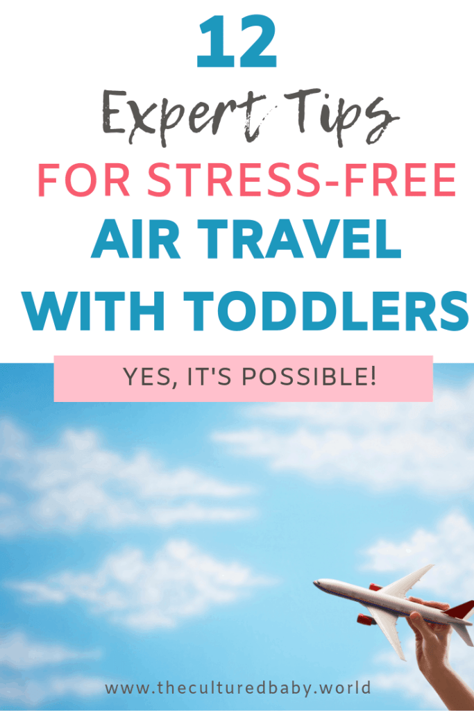 12 expert tips for stress free air travel with toddlers | paper airplane held by a hand in the sky