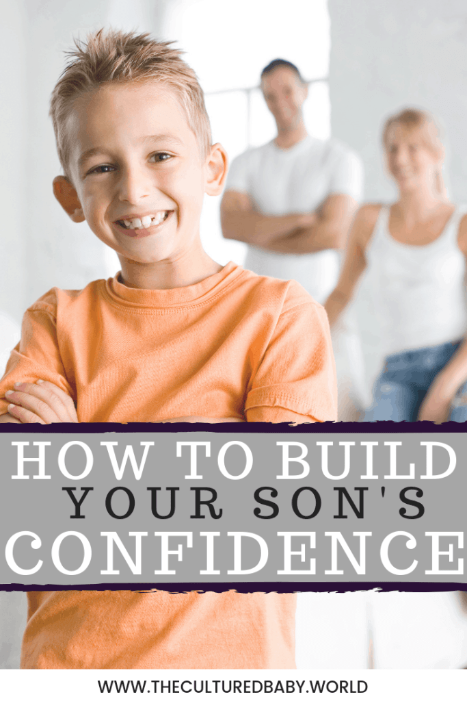young boy smiling with his parents standing in the background |How to Build Your Son's Confidence 
