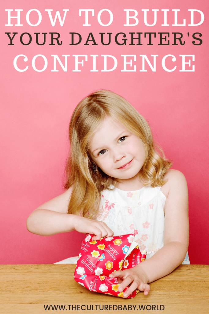 little girl opening a gift |building self-confidence