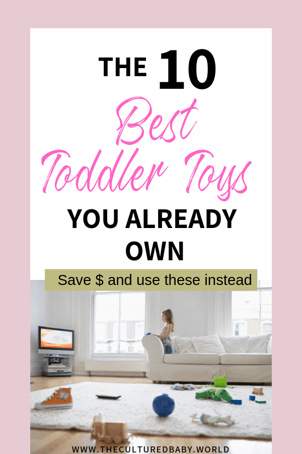 Little girl sitting on couch with toys scattered on the floor