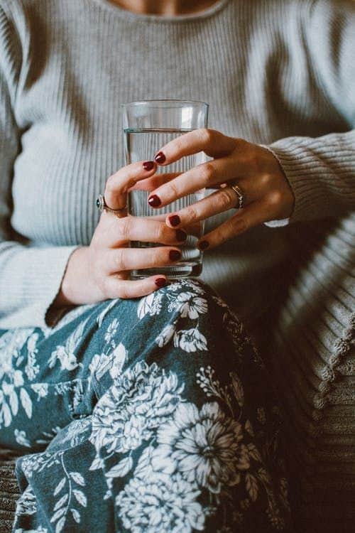 mom drinking a glass of water | sober curious