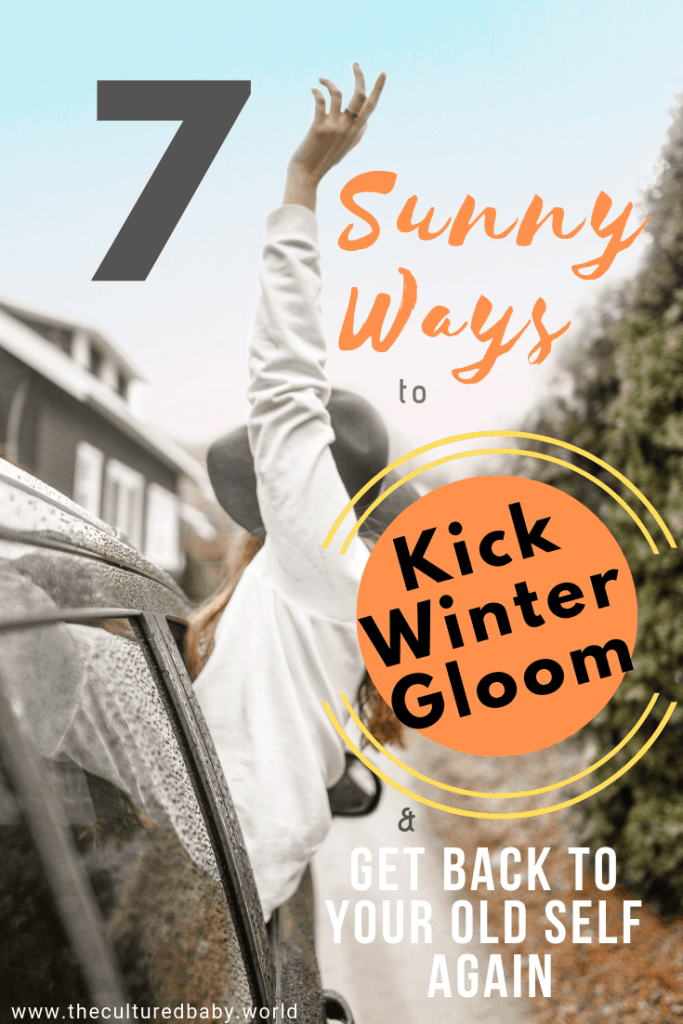 woman hanging out of the car in the rain