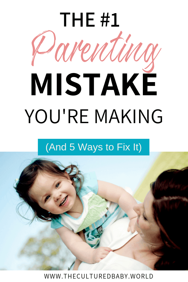 mom laying on the grass holding her toddler girl on her tummy 