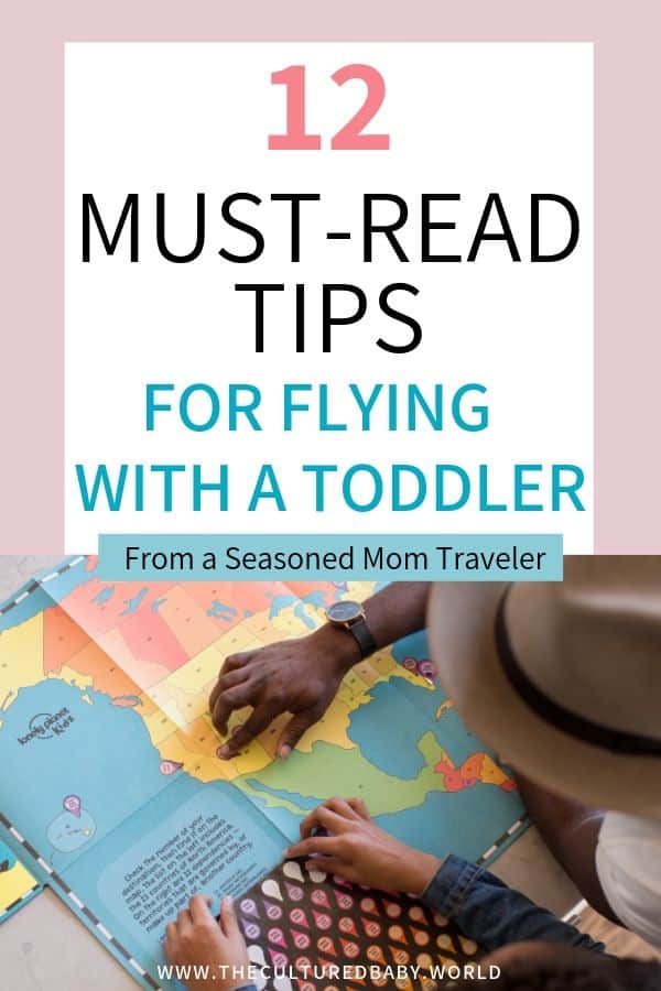 dad and daughter examining a  travel map | tips for flying with a toddler | lap baby 