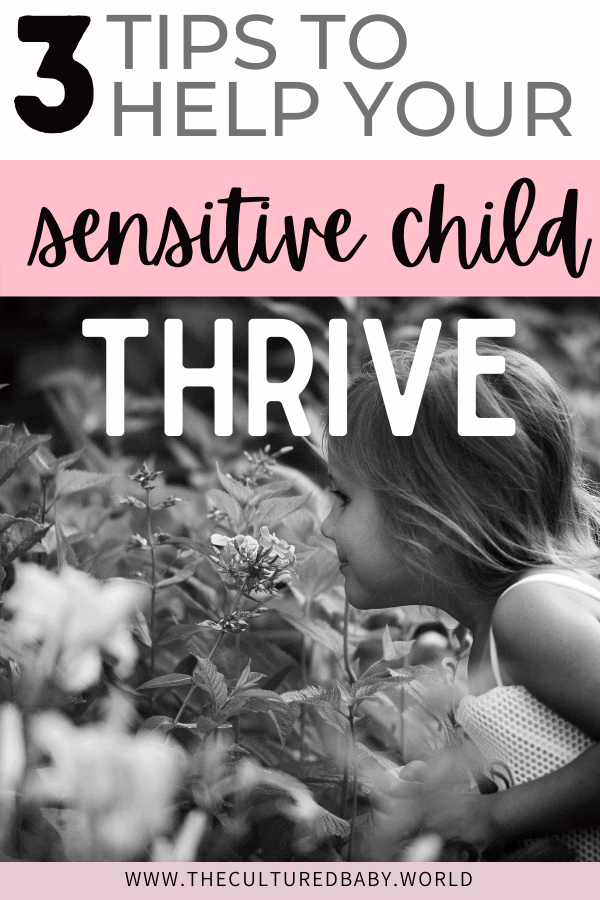 little girl smelling the flowers